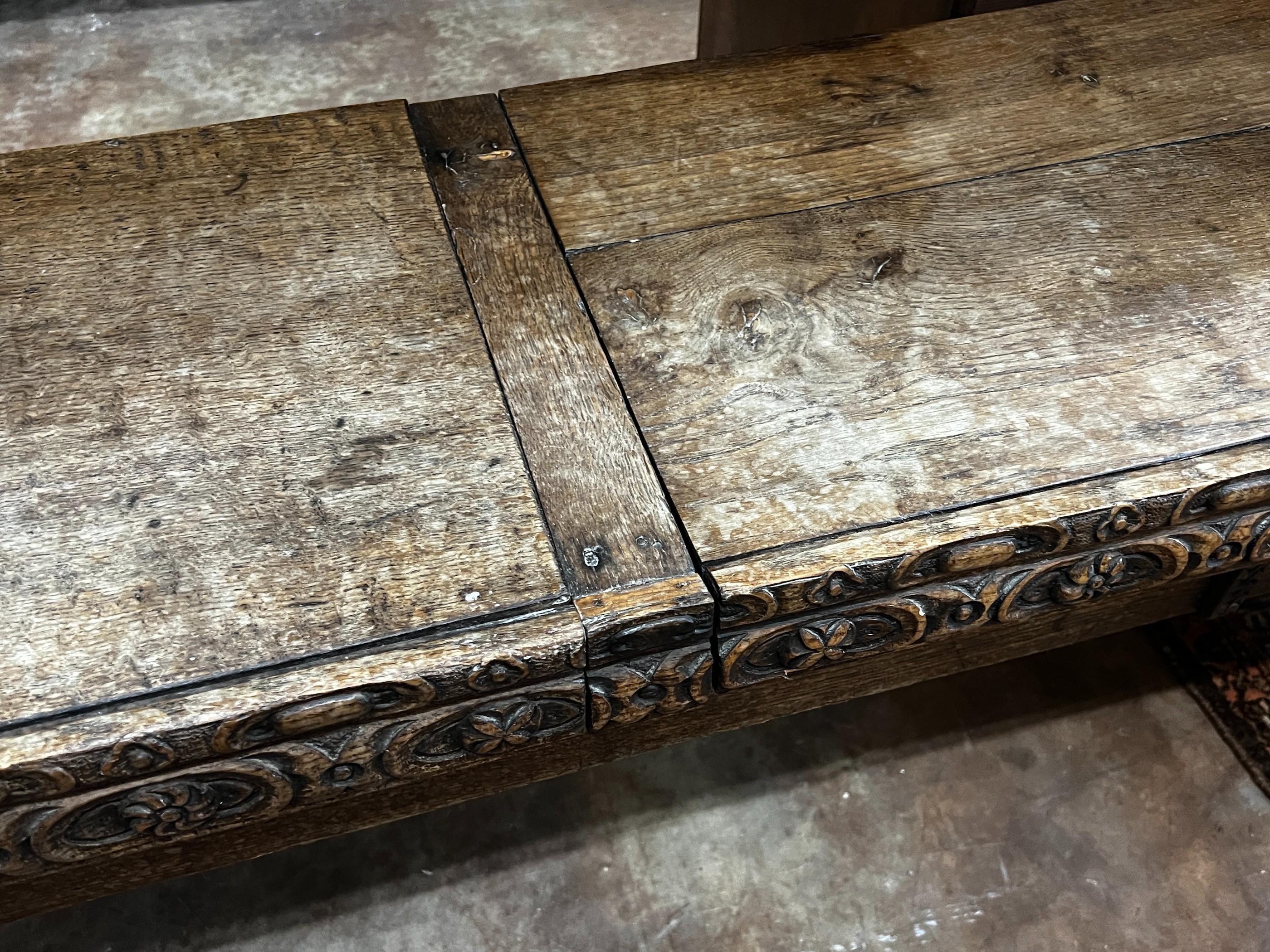 An 18th century and later carved oak hall bench with twin hinged box seat, width 183cm, depth 40cm, height 55cm